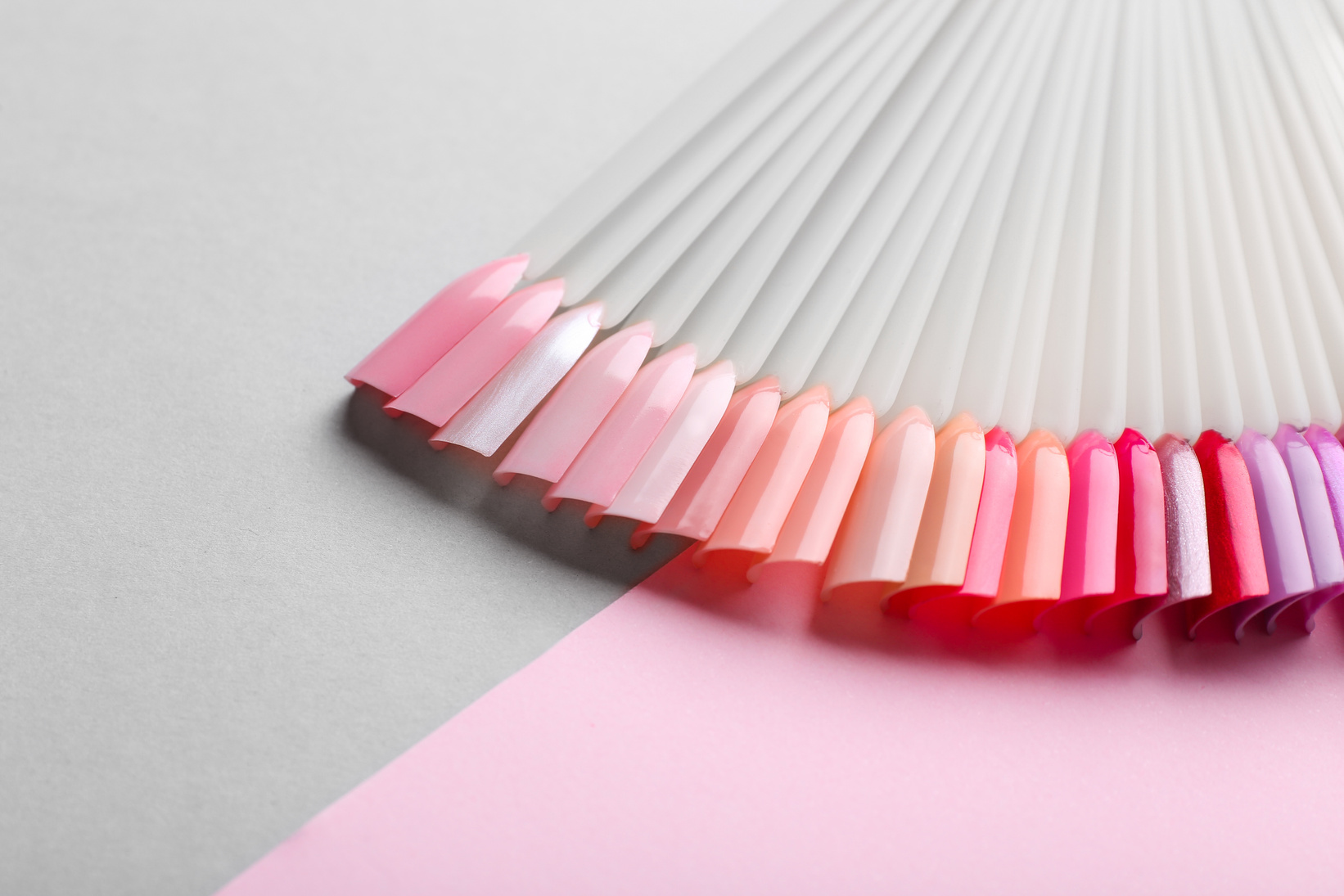 Artificial Nails on Color Background